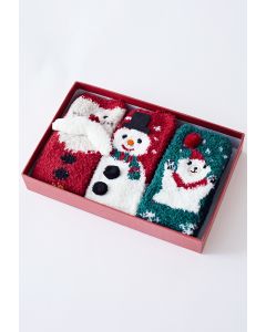 Caixa de presente com meias felpudas de Papai Noel