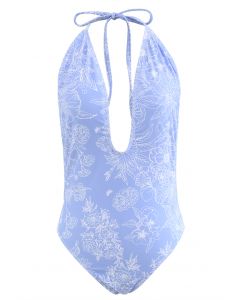 Fato de banho aberto nas costas com desenho floral em azul