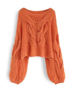 Suéter de mangas bufantes tricotado à mão em laranja
